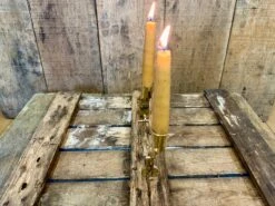 Bundle Of Two 13-16thC Folding Brass Candlesticks -Tod Cutler Shop FoldingBrassCandlestick litandstandinginwoodsideview